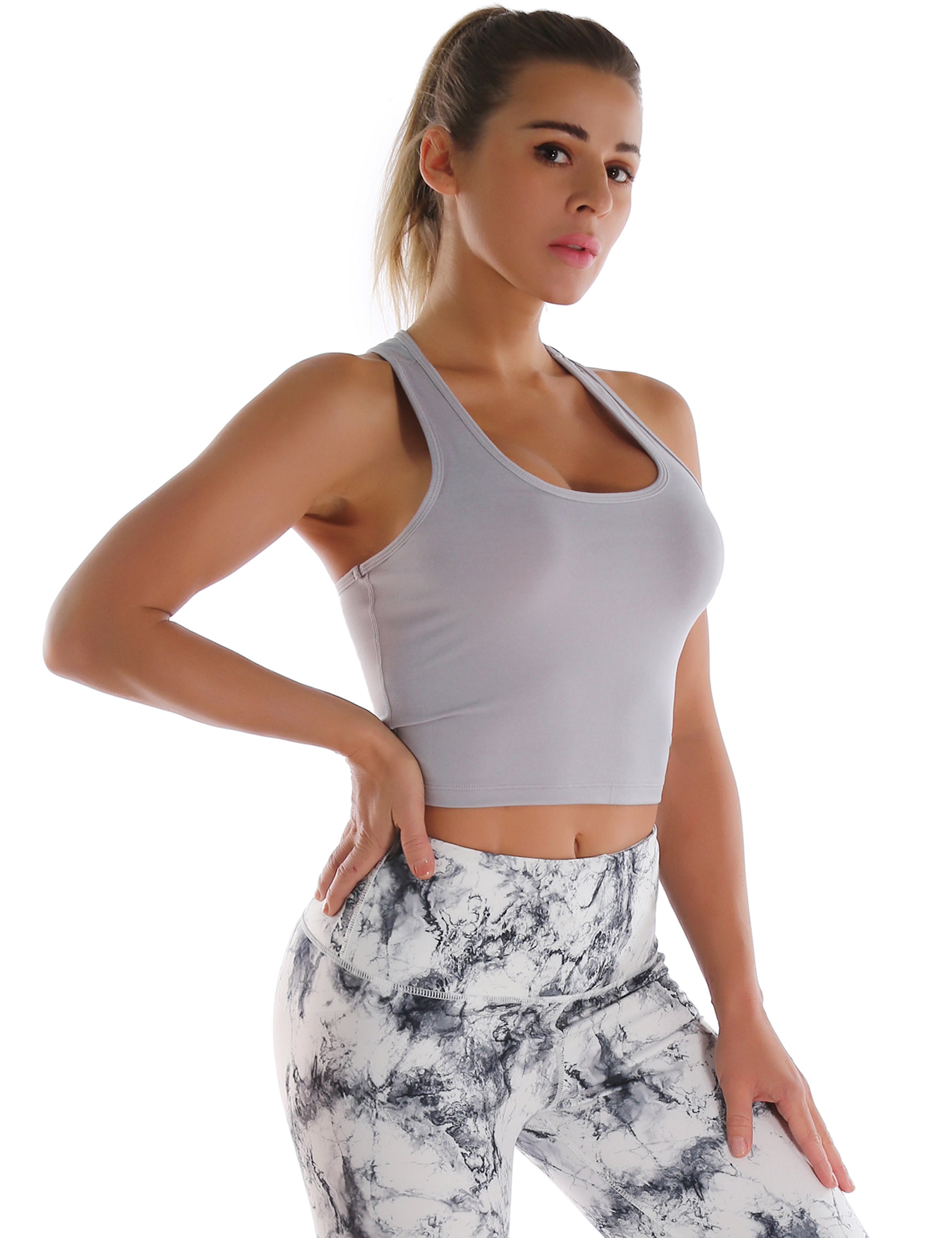 Racerback Athletic Crop Tank Tops heathergray 92%Nylon/8%Spandex(Cotton Soft) Designed for Biking Tight Fit So buttery soft, it feels weightless Sweat-wicking Four-way stretch Breathable Contours your body Sits below the waistband for moderate, everyday coverage